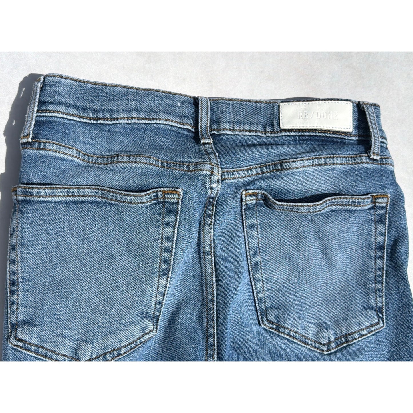 Re/Done Size 28  "70's Stove Pipe" Medium Wash Distressed Hem