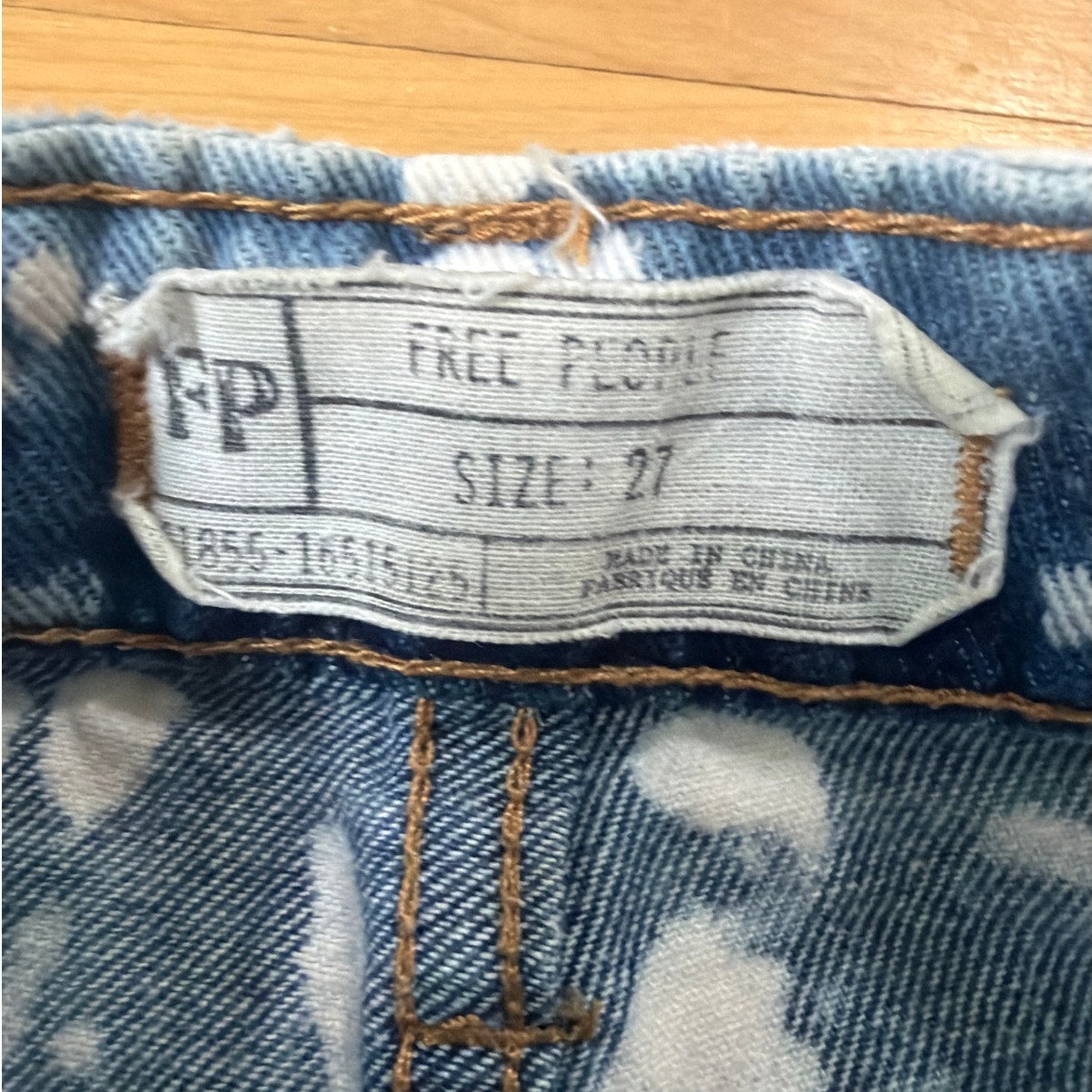 Free People Size 27 White pattern Ripped shorts with Red Striped pockets