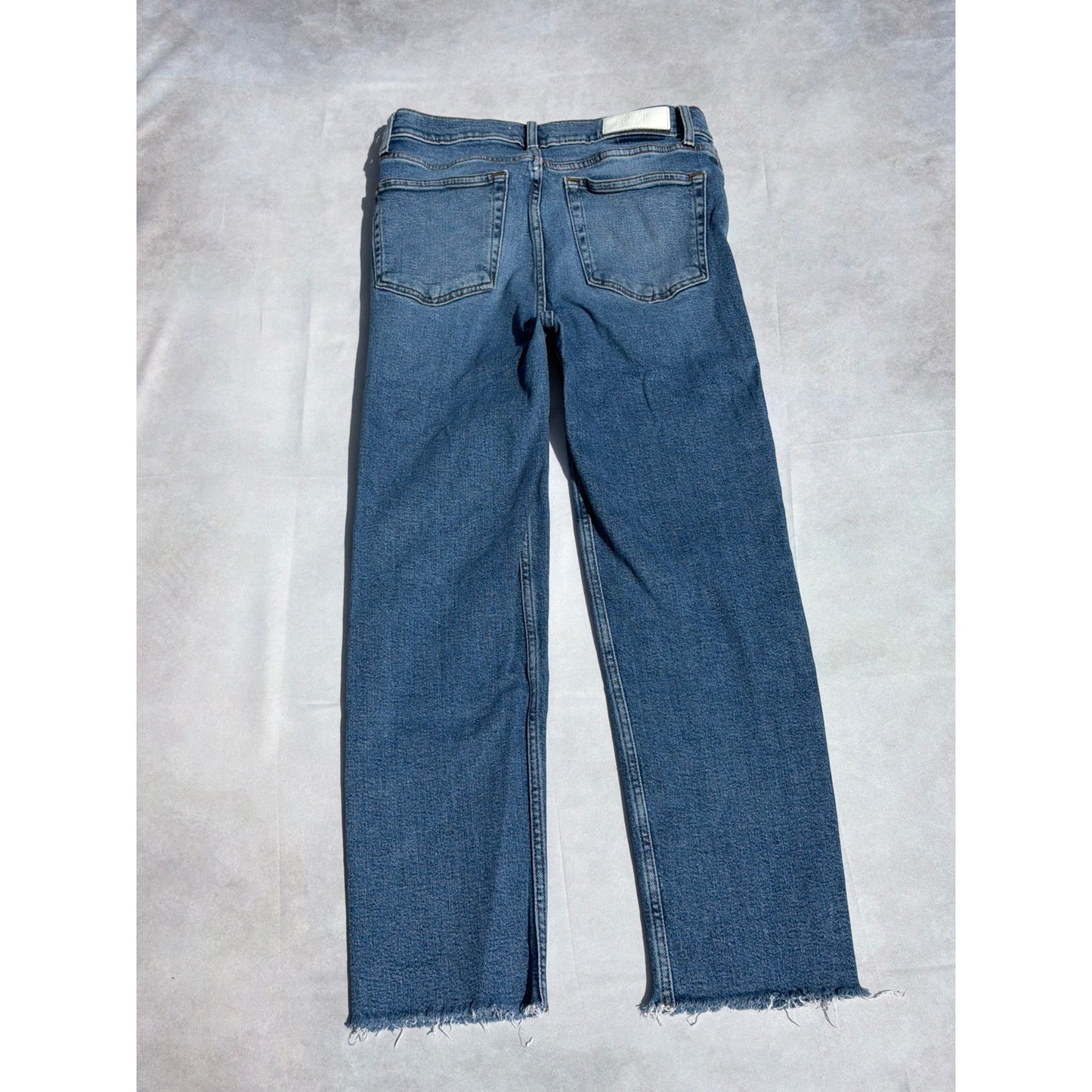 Re/Done Size 28  "70's Stove Pipe" Medium Wash Distressed Hem