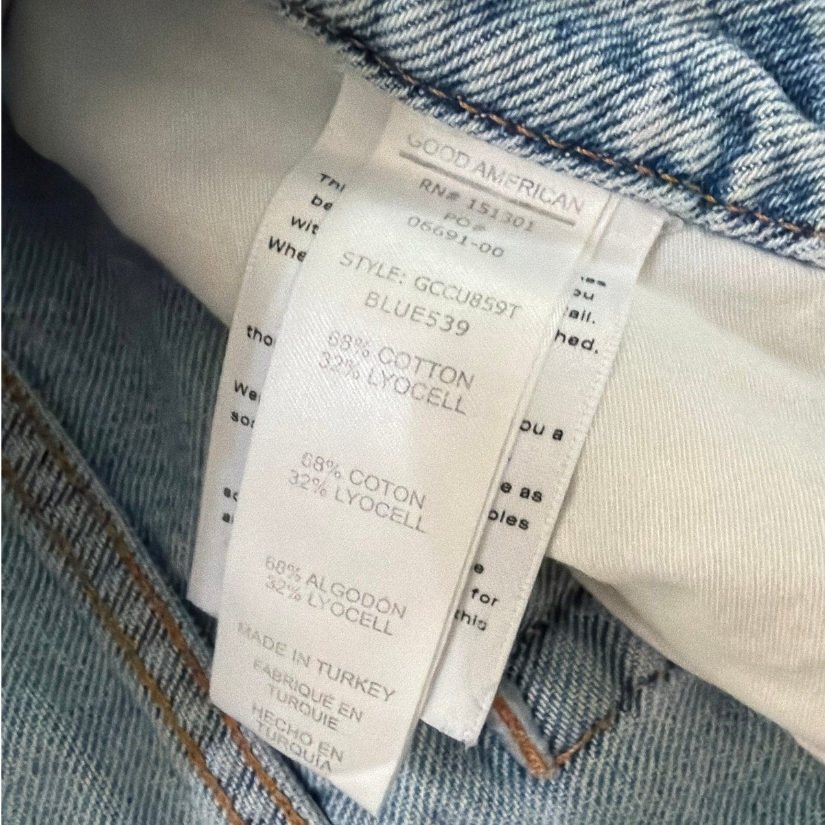 Good American Size 4/27 Light Wash Mid Rise Ripped Jeans