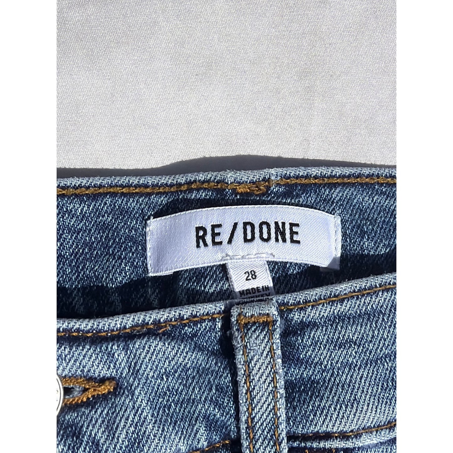 Re/Done Size 28  "70's Stove Pipe" Medium Wash Distressed Hem