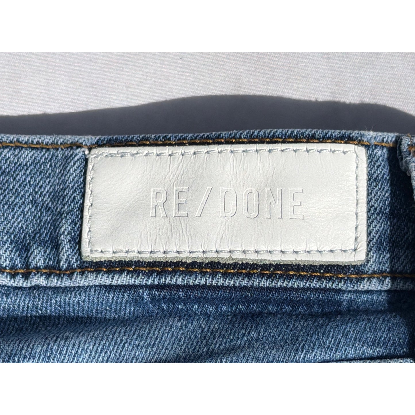 Re/Done Size 28  "70's Stove Pipe" Medium Wash Distressed Hem